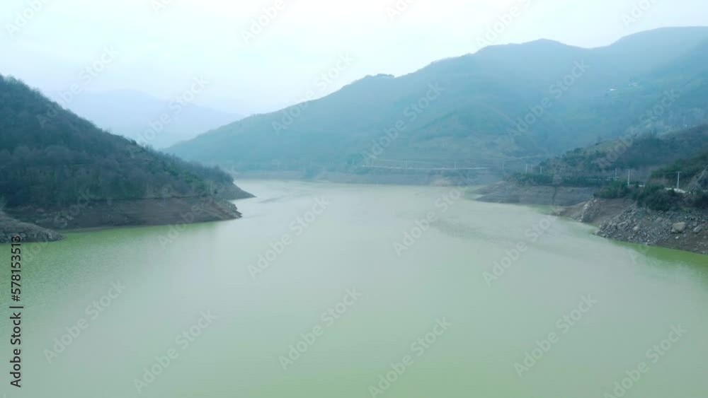 Drought in Turkey. Drought crisis in Türkiye. Aerial view of dam with low water level. Yuvacik dam or Kirazdere dam in Kocaeli Turkey. Drone view.