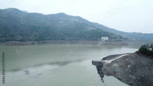 Drought in Turkey. Drought crisis in Türkiye. Aerial view of dam with low water level. Yuvacik dam or Kirazdere dam in Kocaeli Turkey. Drone view. photo