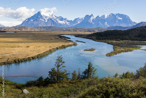 Serrano River, golden pampas and snowy mountains of Torres del Paine National Park in Chile, Patagonia, South America