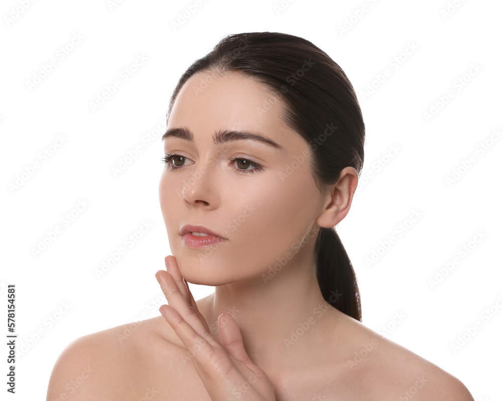 Young woman massaging her face on white background