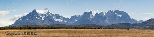 Golden Pampas and snowy mountains of Torres del Paine National Park in Chile, Patagonia, South America - Panorama