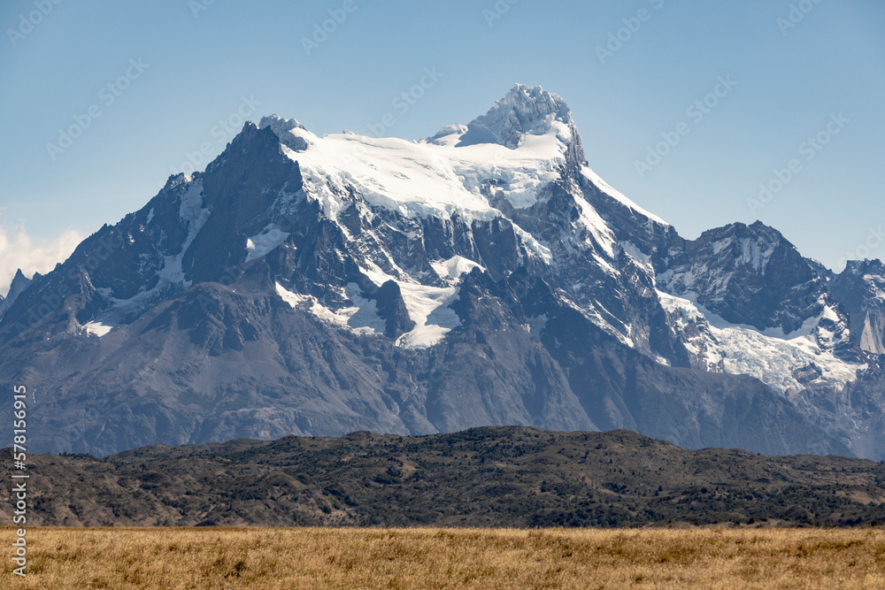 Golden Pampas and snowy mountains of Torres del Paine National Park in Chile, Patagonia, South America