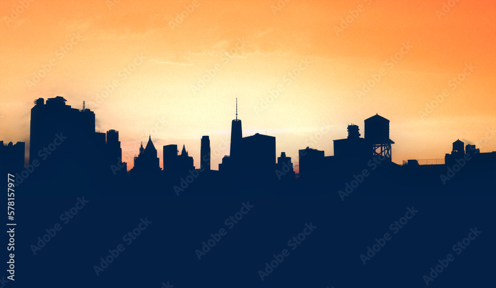 New York City skyline buildings form silhouette shapes against the yellow background sky in Manhattan NYC