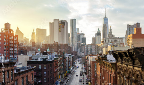 Overhead view of Madison Street in the Chinatown neighborhood of Manhattan with the downtown skyline buildings of New York City in background