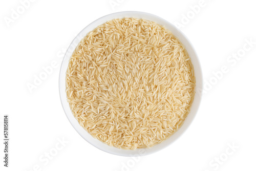 Basmati long rice in bowl isolated on white background photo