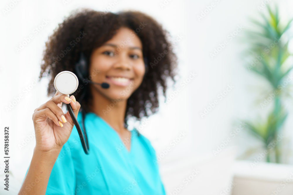 American - African black ethnicity female doctor gives a consultation to patient, online or tele medicine service. Doctor talking to patient through online video conference. American - African black ethnicity female doctor gives a consultation to patient, online or tele medicine service. Doctor talking to patient through online video conference.
