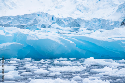 View of icebergs, sea ice, and glacier ice in Antarctica