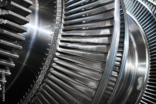 Shiny blades of high-speed steam turbine in workshop