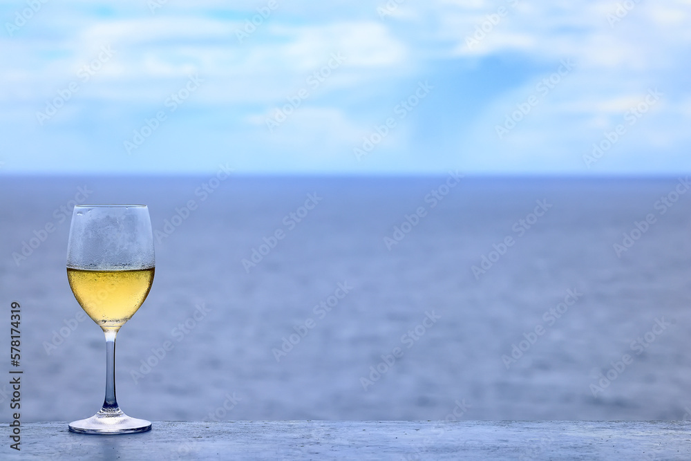 white wine tasting, chilled ice wine in a cold glass in summer white wine tasting, chilled ice wine in a cold glass in summer