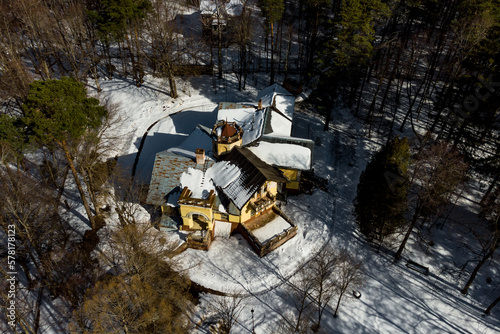 Winter landscape with a view of an old mansion in the middle of the forest, aerial view. Manor Turliki built in 1901, Obninsk, Russia