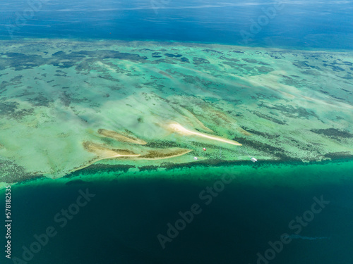 Sandbar and coral reef in turquoise water. Negros, Philippines. photo