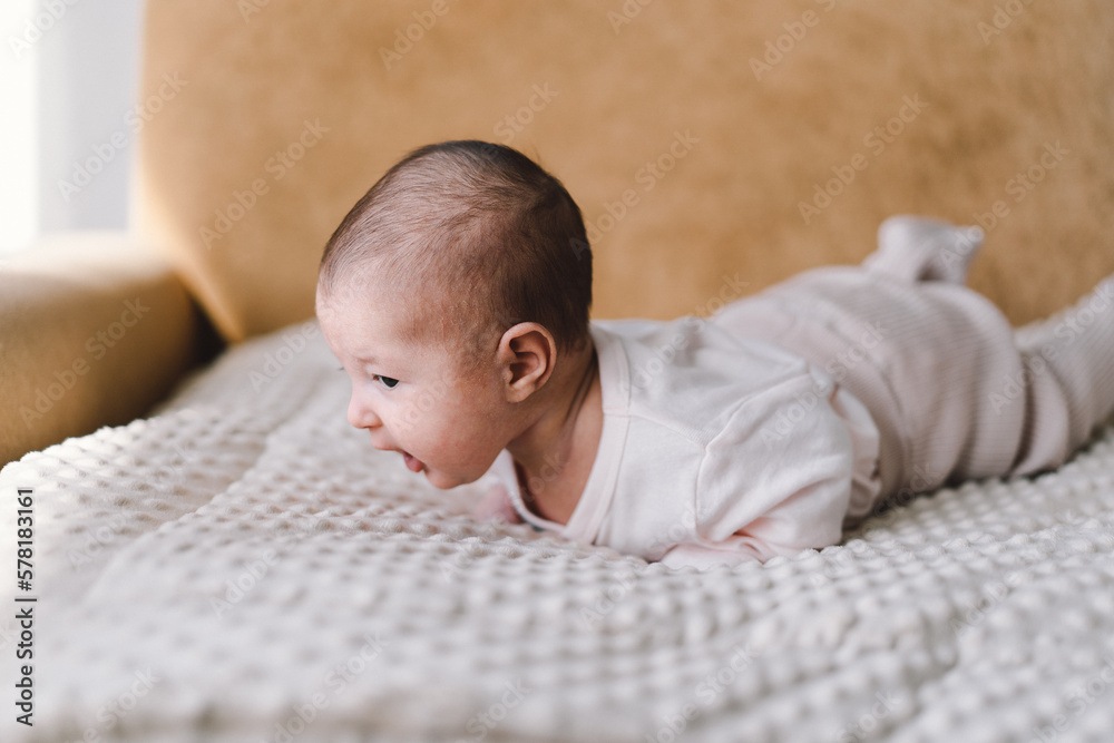 Baby learns to hold its head and roll over on my stomach. The benefits