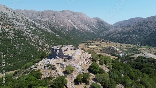 Aerial view over Turkish castle fortress ruins in the Leuka Ori mountains and Improu gorge, Askifou Crete photo