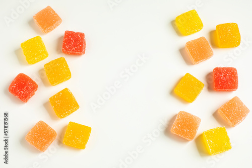 Pieces of fruit jelly on white