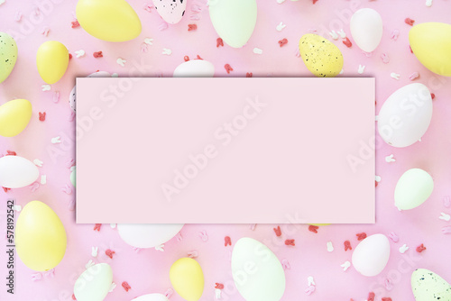 Colorful Easter eggs on pink background. Egg hunting. © ukrolenochka