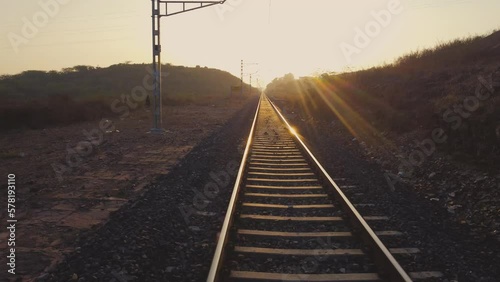 POV of a Train Running on Rail tracks in India at Golden hour photo