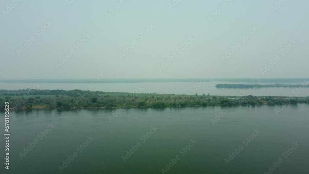 Aerial: Flooded islands in the Parana river in Paraguay on a misty morning. Aerial: Flooded islands in the Parana river in Paraguay on a misty morning.