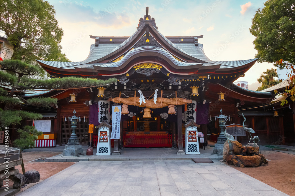 Fukuoka, Japan - Nov 20 2022: Kushida shrine in Hakata ward, founded in 757, the shrine dedicated to Amaterasu the goddess of the sun and Susanoo god of seas and storms, thunder and lightning Fukuoka, Japan - Nov 20 2022: Kushida shrine in Hakata ward, founded in 757, the shrine dedicated to Amaterasu the goddess of the sun and Susanoo god of seas and storms, thunder and lightning