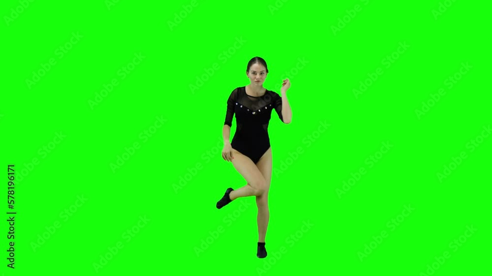 Stunning female dancer dancing a modern dance in front of a green screen Stunning female dancer dancing a modern dance in front of a green screen