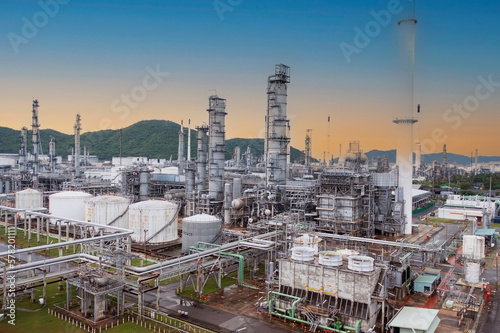 The oil refinery plant form industry zone ,which the factory - petrochemical plant, Shot from drone of Oil refinery with sunset sky scene