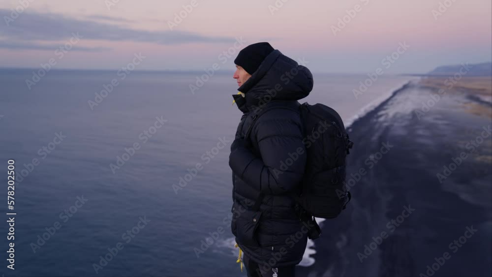 Man Watching Dawn, Dyrholaey Iceland Man Watching Dawn, Dyrholaey Iceland