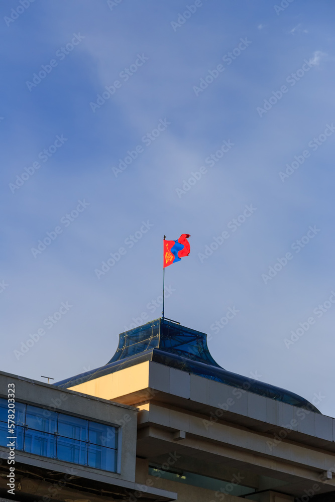 Mongolia, Ulaanbaatar - August 08, 2018: Flag of Mongolia set on The Government Palace is located on the north side of Genghis Square