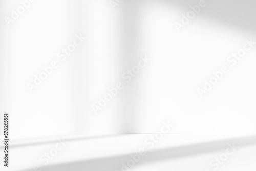 Abstract white studio background for product presentation. Empty room with shadows of window. Display product with blurred backdrop.