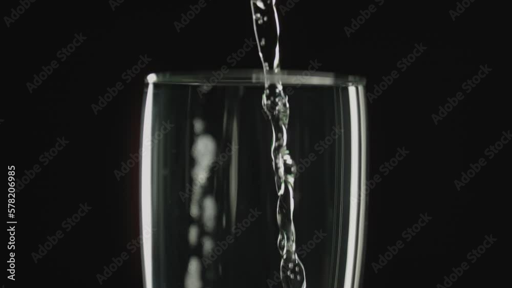 Pouring Champagne Into Glass In Slow Motion Pouring Champagne Into Glass In Slow Motion