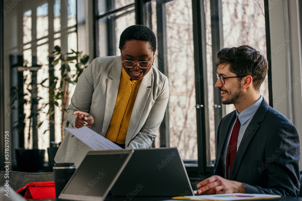 Business coworkers working together at office. Diverse people working in the bright office. Business coworkers working together at office. Diverse people working in the bright office.