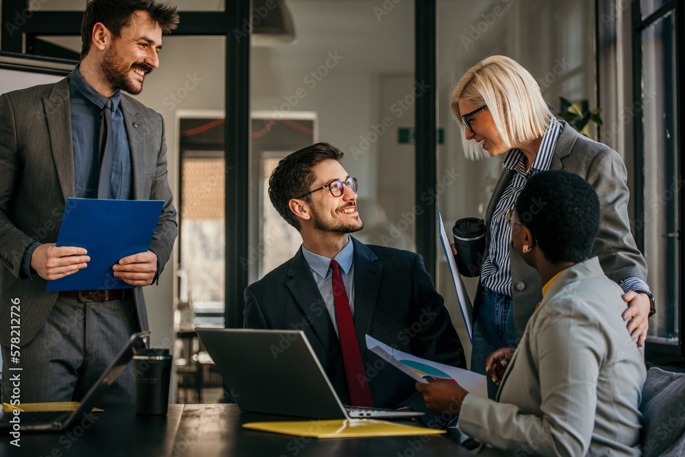 Business diversity - A multi ethnicity suited up dressed team in the discussion.