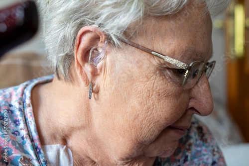 woman wearing digital hearing aid