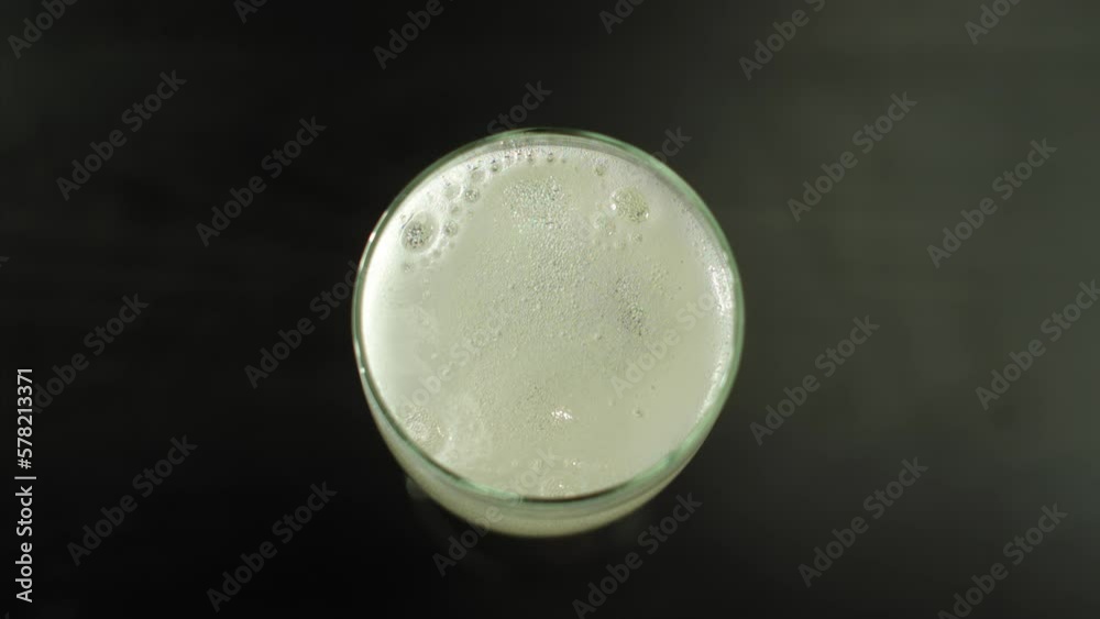 Top View Of Champagne Foam In A Glass
