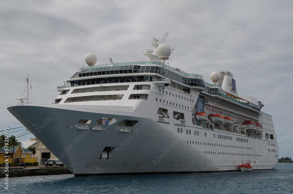 Modern white Royal Caribbean cruiseship or cruise ship liner Empress in port of Nassau, Bahamas during Caribbean cruising to tropical islands for dream holiday vacation	