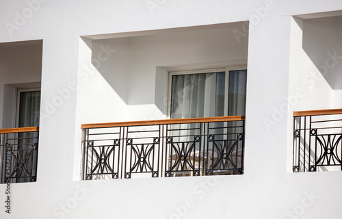 Balcony in a white building.