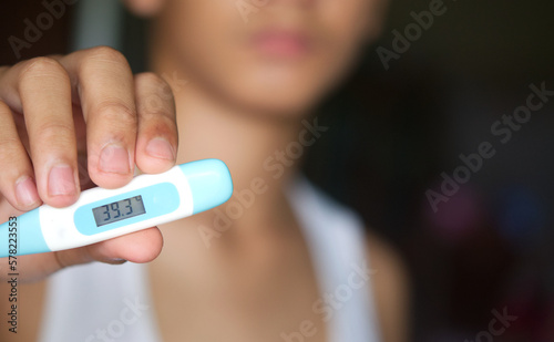 High digit on thermometer.High fever is a common symptom of illness  usually indicating that the body is fighting an infection. However  persistent or very high fever may require medical attention.