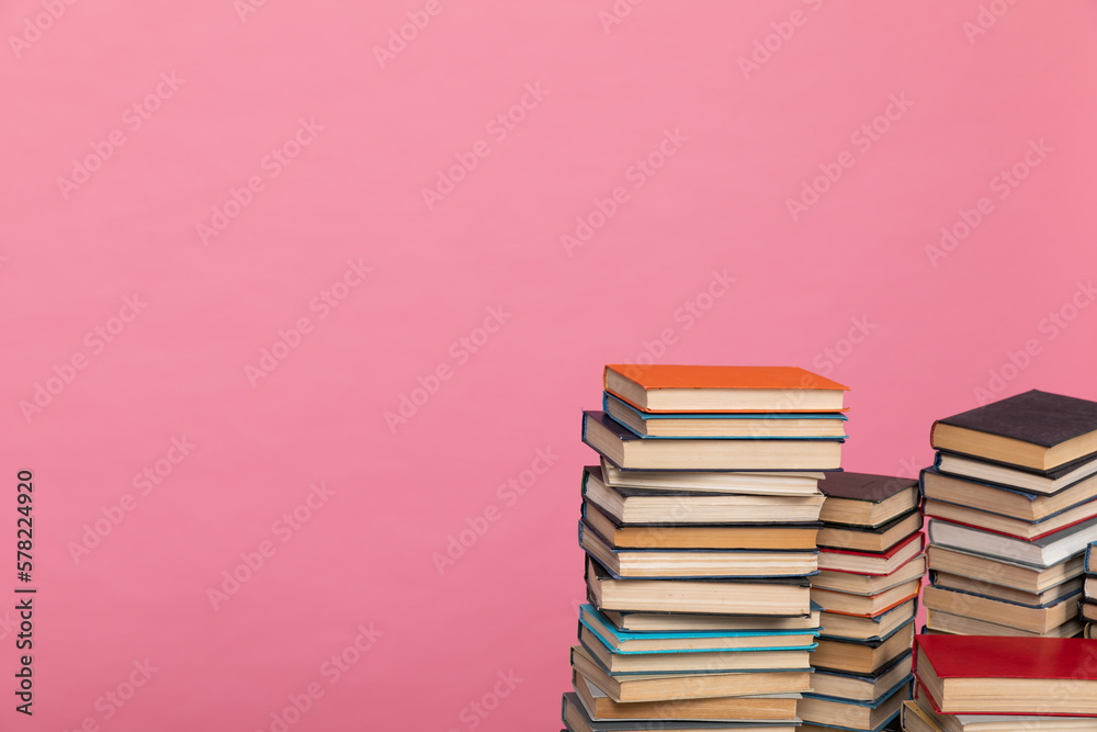 many books on a pink background in the library in the office of science knowledge reading