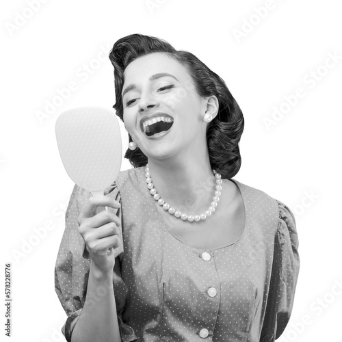 Elegant woman looking at herself in a mirror