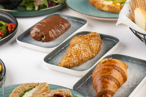 Fresh tasty croissants of Cheese, Thyme and Chocolate on a plate 