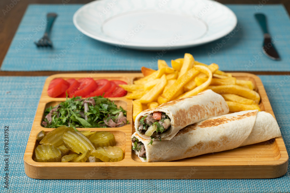 Shawarma Plate, Shawarma Beef served with pickles, veggies and tomatoes with tahina dip
Shawarma Plate, Shawarma Beef served with pickles, veggies and tomatoes with tahina dip