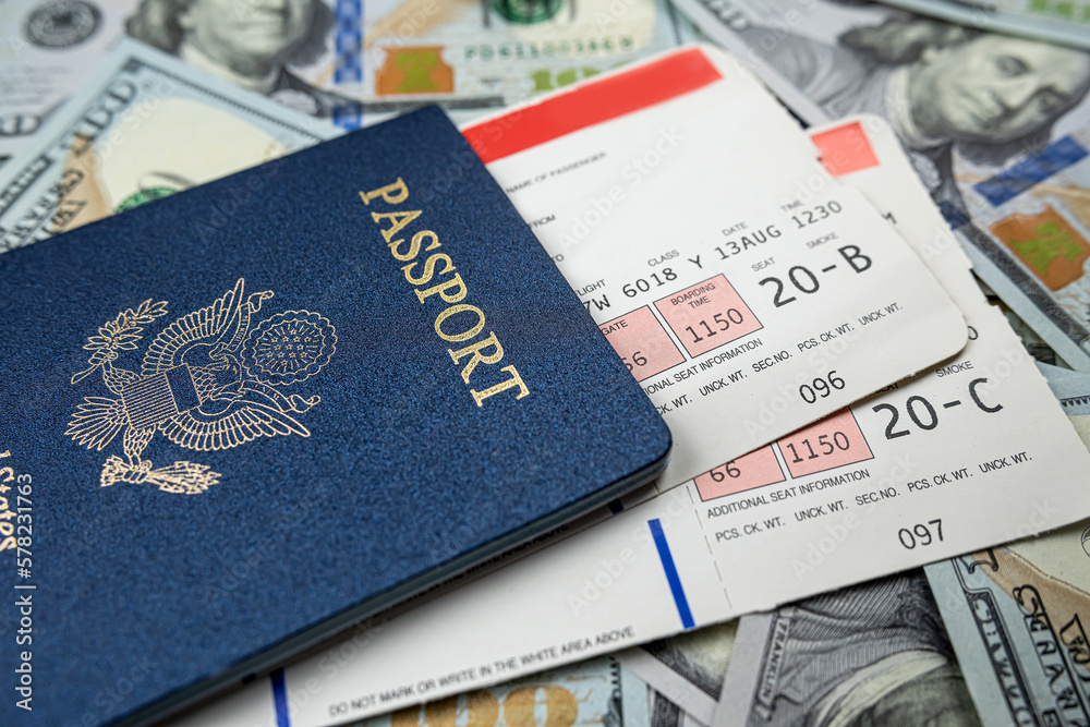 USA passport with travel ticket and dollar money USA passport with travel ticket and dollar money