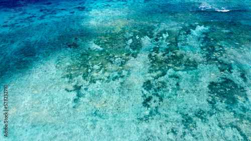 Stunning coral reef marine ecosystem in crystal clear turquoise ocean water in the Coral Triangle of Timor-Leste, Southeast Asia, aerial drone view of reefs