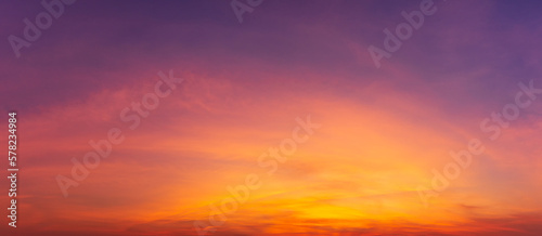 Photos of twilight sky before sunrise or after sunset, cirrus clouds over the sky, panorama image. orange tones, natural phenomenon background. © c_atta