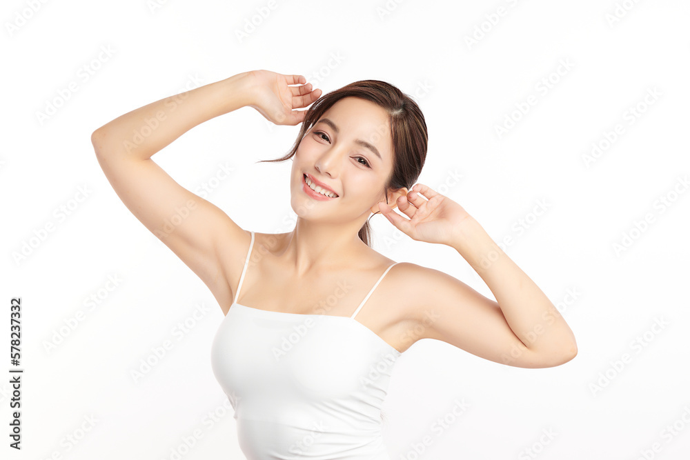 Beautiful Young Asian woman lifting hands up to show off clean and hygienic armpits or underarms on white background, Smooth armpit cleanliness and protection concept Beautiful Young Asian woman lifting hands up to show off clean and hygienic armpits or underarms on white background, Smooth armpit cleanliness and protection concept