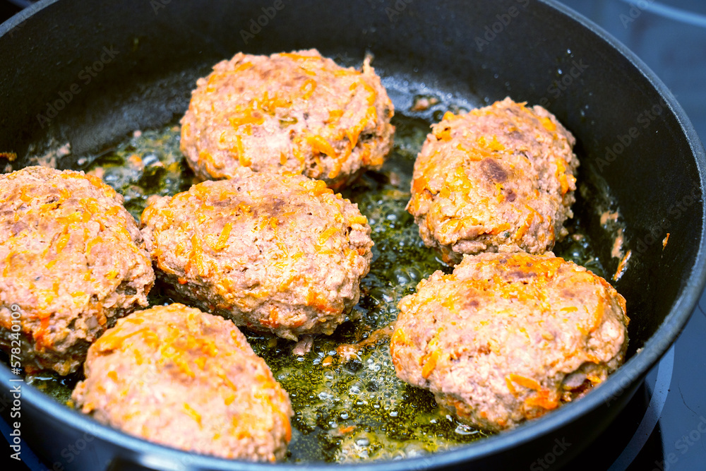 close-up, cooking meatballs in a frying pan