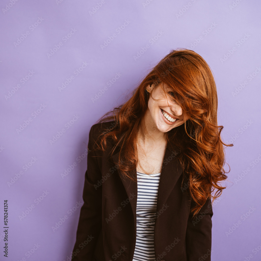 Young Redhead Smiling with Long, Flowing Hair Young Redhead Smiling with Long, Flowing Hair
