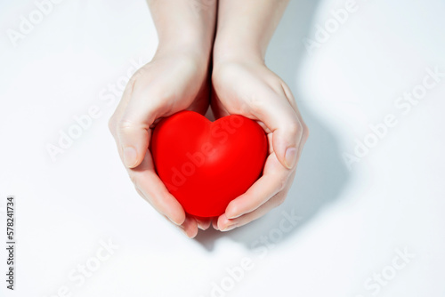 Heart in hands isolated on white background  heart health or love concept