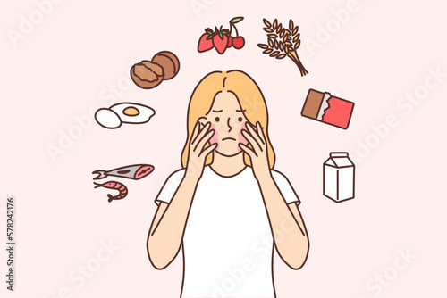 Unhappy girl with problems due to allergies and skin irritation or rash on face after eating