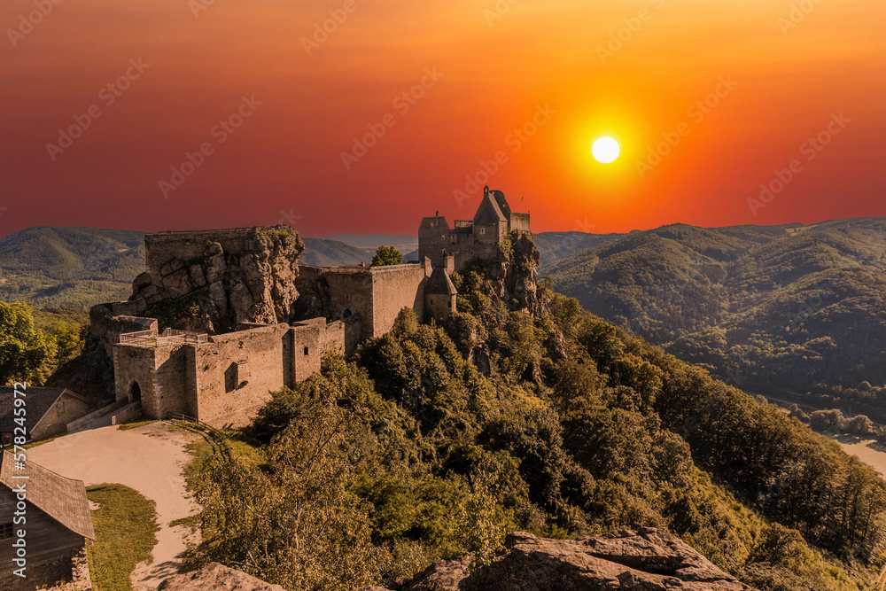 Landscape with Aggstein castle ruin and Danube river at sunset in Wachau walley Austria.