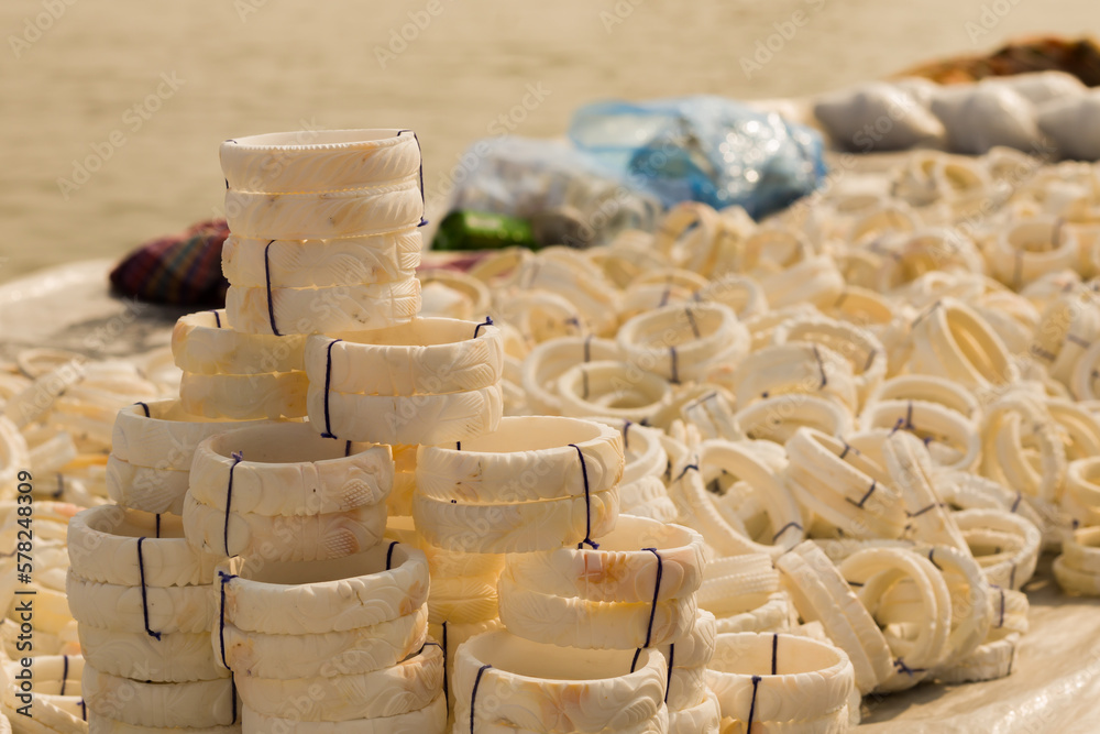 shankha or white bangles made of conch shells being sold near sea beach