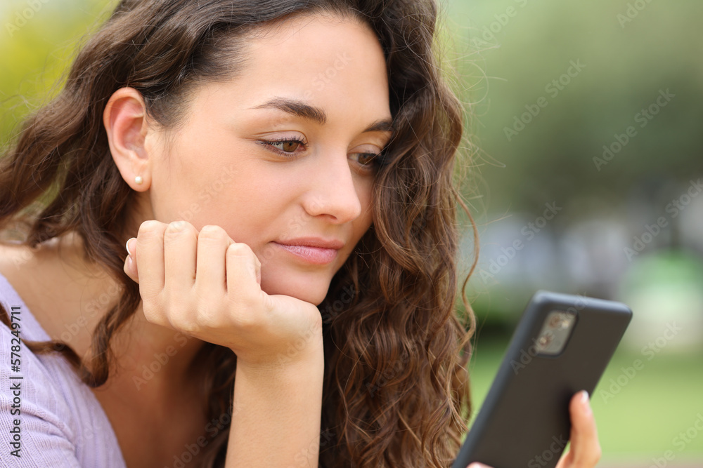 Woman using smart phone outside